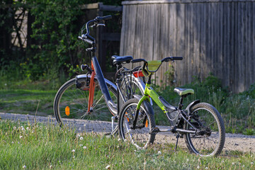 Fototapeta na wymiar Two bicycles are parked on the side of a rural road