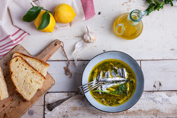 Marinated anchovies in lemon juice with olive oil garlic and parsley