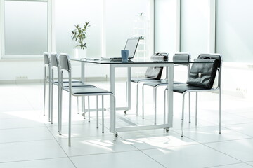 Laptop medical stethoscope coffee cup phone day planner on glass table in office space