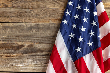 Obraz premium American flag for Memorial Day, Labour Day. Independence Day isolated over wooden background. Flyer with copy space for ad, text