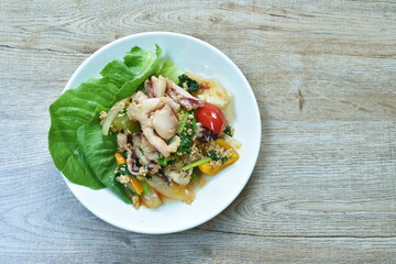 stir fried squid in yellow curry and egg on plate