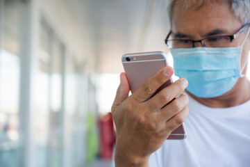 Elderly people register for COVID-19 vaccination on phone application system