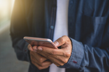 Man using smartphone technology. Businessman holding mobile phone
