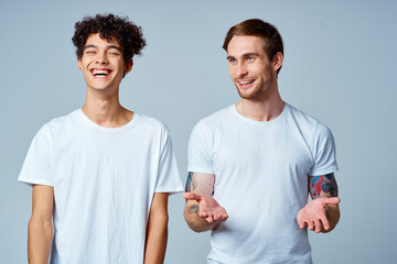 emotional two friends in white t-shirts yes fun studio