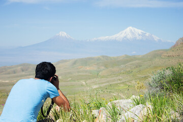 Fototapeta premium the photographer photographs the mountain