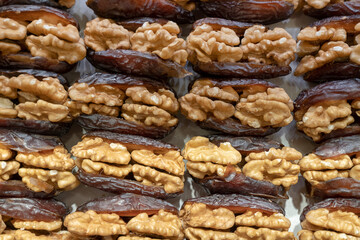 Dessert dates stuffed with nuts.  Top view blur textures soft focus