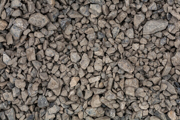 brick rubble debris on construction site. inorganic crushed stone, non-round, loose material with...