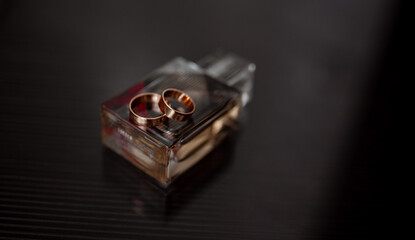 wedding rings on perfume