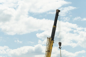 Fototapeta na wymiar Construction crane against blue sky