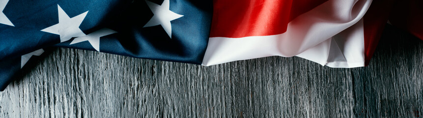american flag on a gray wooden surface, web banner - Powered by Adobe