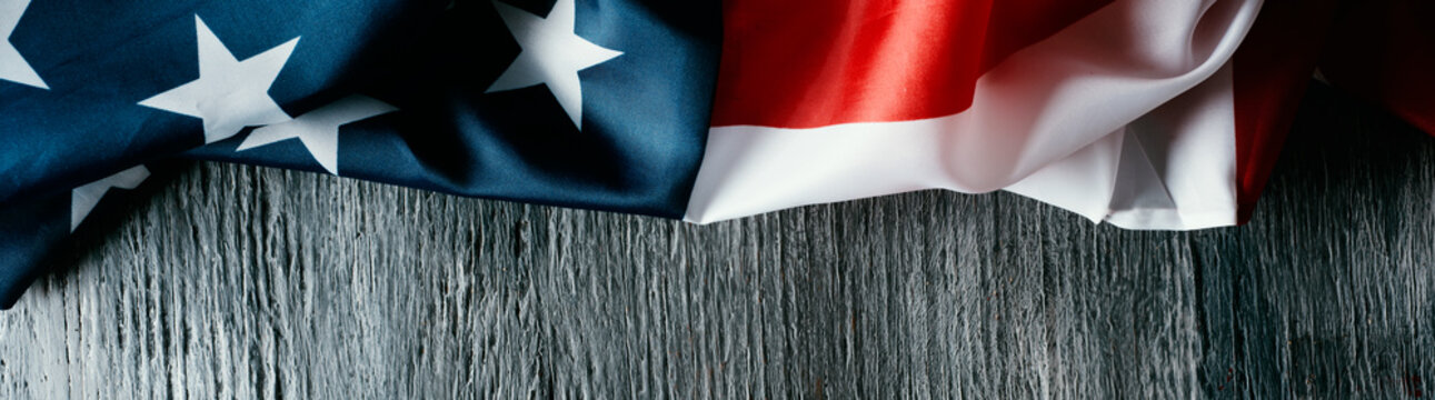 american flag on a gray wooden surface, web banner