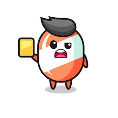 cartoon candy character as a football referee giving a yellow card