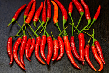 red chili peppers on wooden table