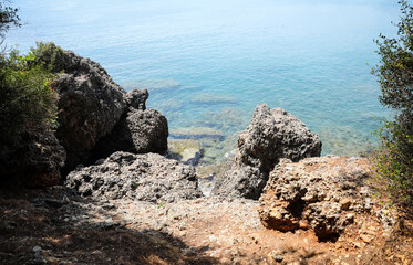 Fototapeta na wymiar Beautiful view of rocky sea coast on sunny summer day