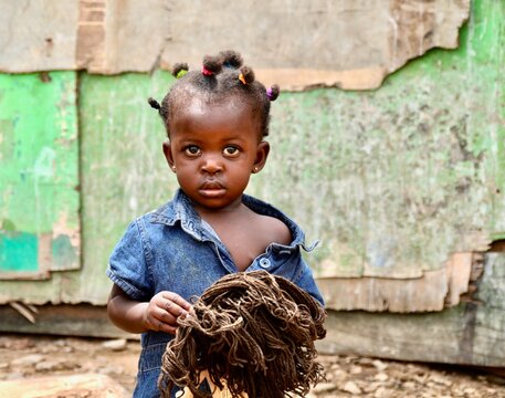 Portrait Of A Little Girl With A Doll