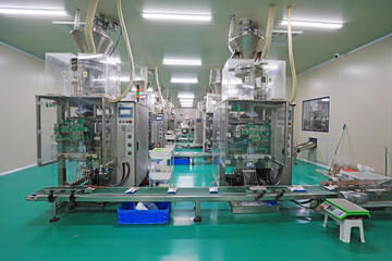 The workers work on the salt packing line