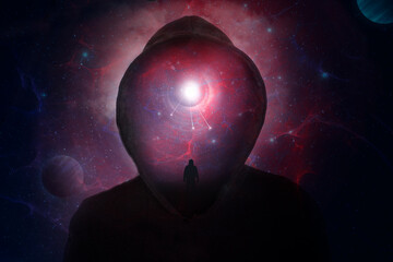 A science fiction concept of a hooded figure without a face. Over layered with a man looking into a...