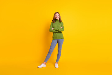 Full length body size photo smiling girl in casual clothes with crossed hands isolated vivid yellow color background