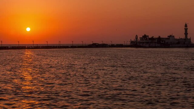 Day to Night Time-lapse of Haji Ali Dargah during a beautiful Sunset. Maharashtra, India