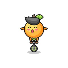 The cute orange fruit character is riding a circus bike