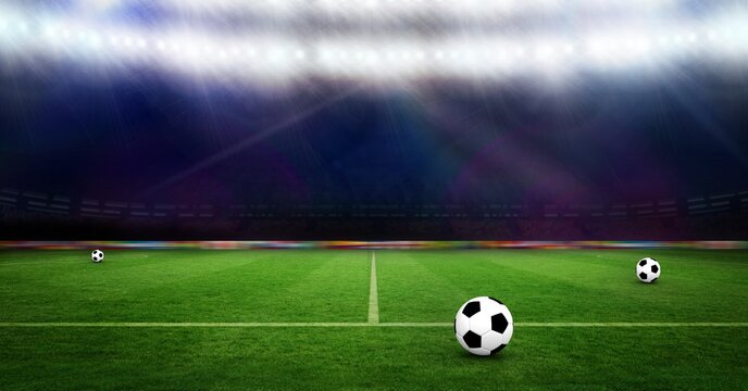 Composition of three footballs on football pitch with spotlights in sports stadium