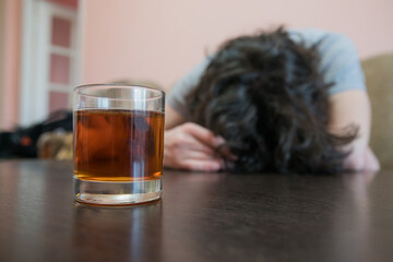 sad man with glass of alcohol
