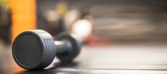 Obraz na płótnie Canvas Dumbbells on floor in gym