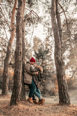 Hiking couple with backpack walking in the forest and exploring outdoors. Freedom and active travel concept.
