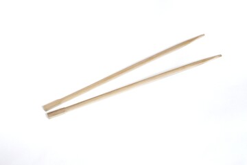 Wooden chopsticks, top view of disposable wooden chopsticks on isolated white background.