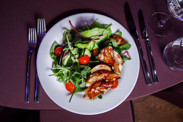 Vegetable salad with chiken fillet on a banquet.