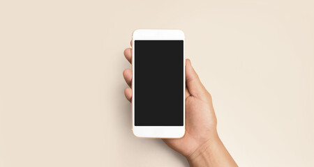 Hand holding smartphone device touching screen
