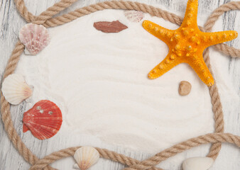 Fototapeta na wymiar Abstract marine background with ropes, seashells, starfish