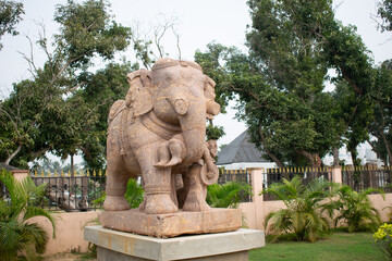 Elephant sculpture isolated over outdoor background