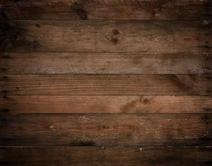 Dunkle Holzstruktur. Verwitterter, vignetted rustikaler Holzhintergrund aus gealterten alten Brettern mit Nägeln. © nevodka.com