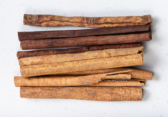 cassia (chinese cinnamon) sticks close up on gray
