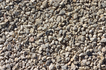 texture - a lot of small stones of sand color