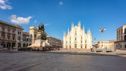 Long exposure of Milan cathedral Duomo and Vittorio Emanuele statue in Square 
