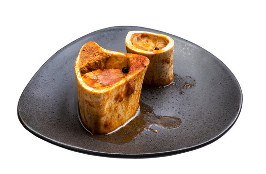 bare cooked cross-cut marrowbones on black plate