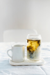 tea with milk on the table on a light background