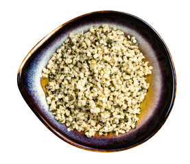 cores of hemp seeds in ceramic bowl isolated