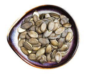 styrian pumpkin seeds in ceramic bowl isolated