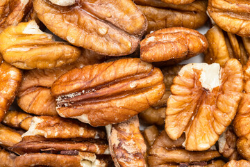 background - many shelled pecan nuts