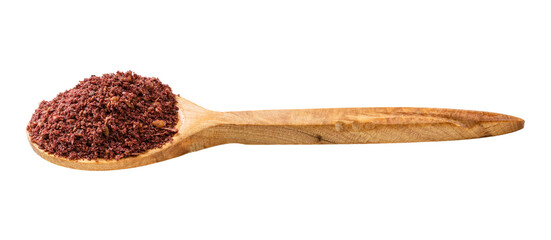 wooden spoon with ground sumac isolated