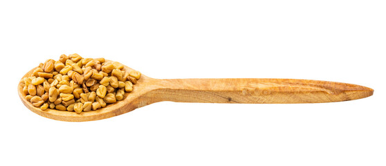 wooden spoon with fenugreek seeds isolated