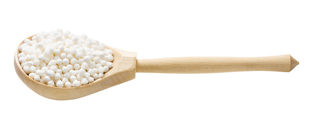 dry sabudana (tapioca sago) in wooden spoon