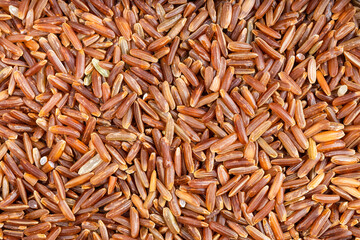 background - many raw red rice grains