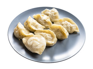 several boiled dumplings on gray plate isolated