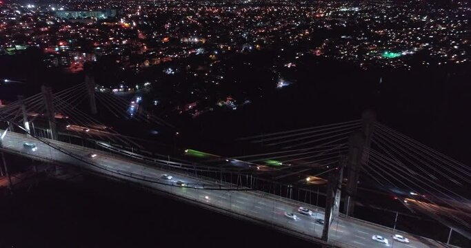 Juan Pablo Duarte and Juan Boch Bridge at night, Santo Domingo. Aerial static view