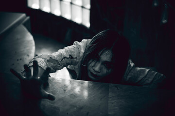 Portrait of asian woman make up ghost face with blood,Horror scene,Scary background,Halloween...