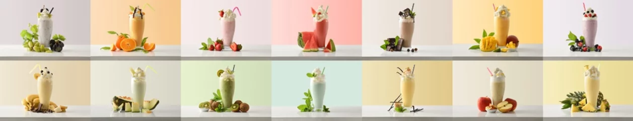 Selbstklebende Fototapeten Eine Reihe von Milchshakes mit verschiedenen Geschmacksrichtungen, die mit fruchtfarbenem Hintergrund dekoriert sind © Davizro Photography